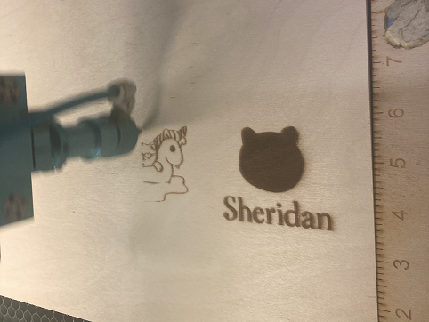 We were first introduced to laser printing in class. We were given an Adobe Illustrator template and a tutorial to follow along with. This is an image of the laser printing process.