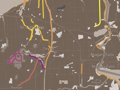 This screenshot is a map of the Niagara Region. The lines represent main bike paths in the Region. Thin lines mean 'On-road' and thick lines mean 'Off-road'. The surfaces colour coded: 1) Yellow: stone/dirt, 2) Light orange: stone dust/paved, 3) Orange: paved, 4) Dark orange: gravel - not graded, 5) Pink: Dirt, 6) Magenta: stone dust/gravel, 7) Purple: unpaved. Because Niagara has a lot of green space and tourist attractions, I was wondering where the locations of the main bike paths were and how this affects accesibility within the city and points of interest.